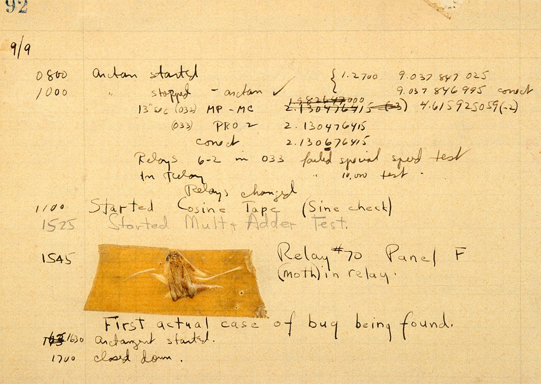 A log book. Written primarily in black ink. An insect’s body is on the page. There is tape overtop the insect’s body to preserve the world’s “first computer bug”.